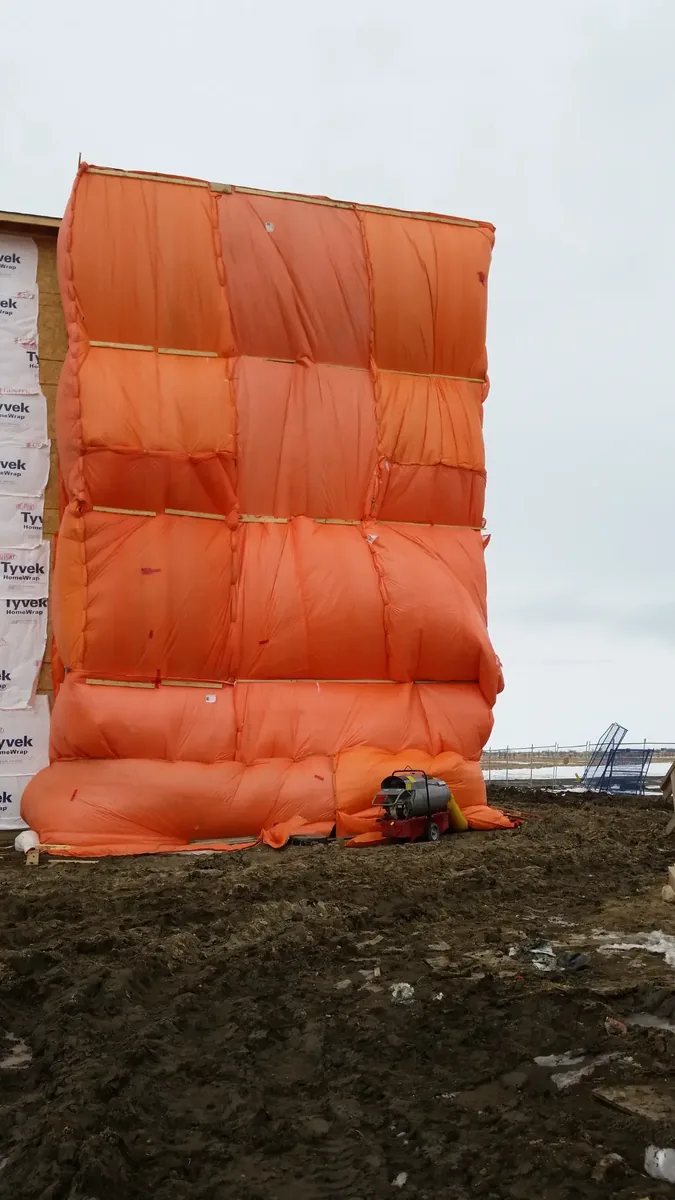 Insulated tarp enclosure winter construction Saskatoon