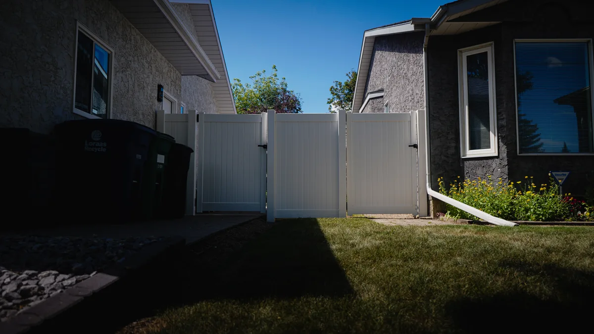 White vinyl privacy fence installed in Saskatoon