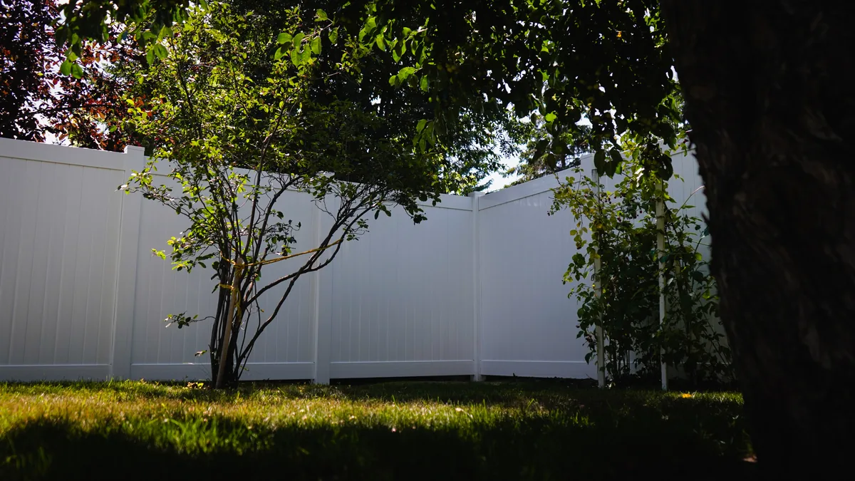 White vinyl privacy fence Saskatoon backyard