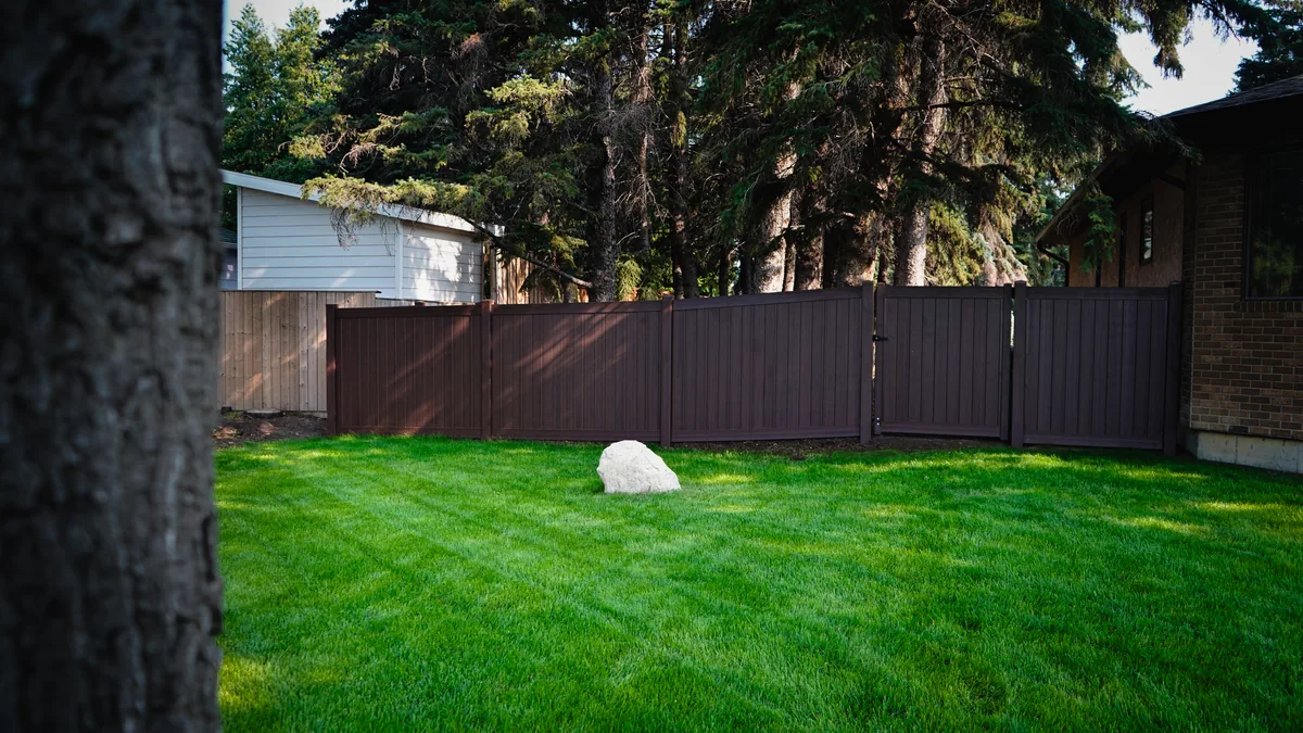 Woodgrain vinyl fence Saskatoon