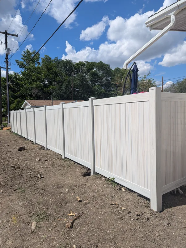 Woodgrain vinyl fence Saskatoon