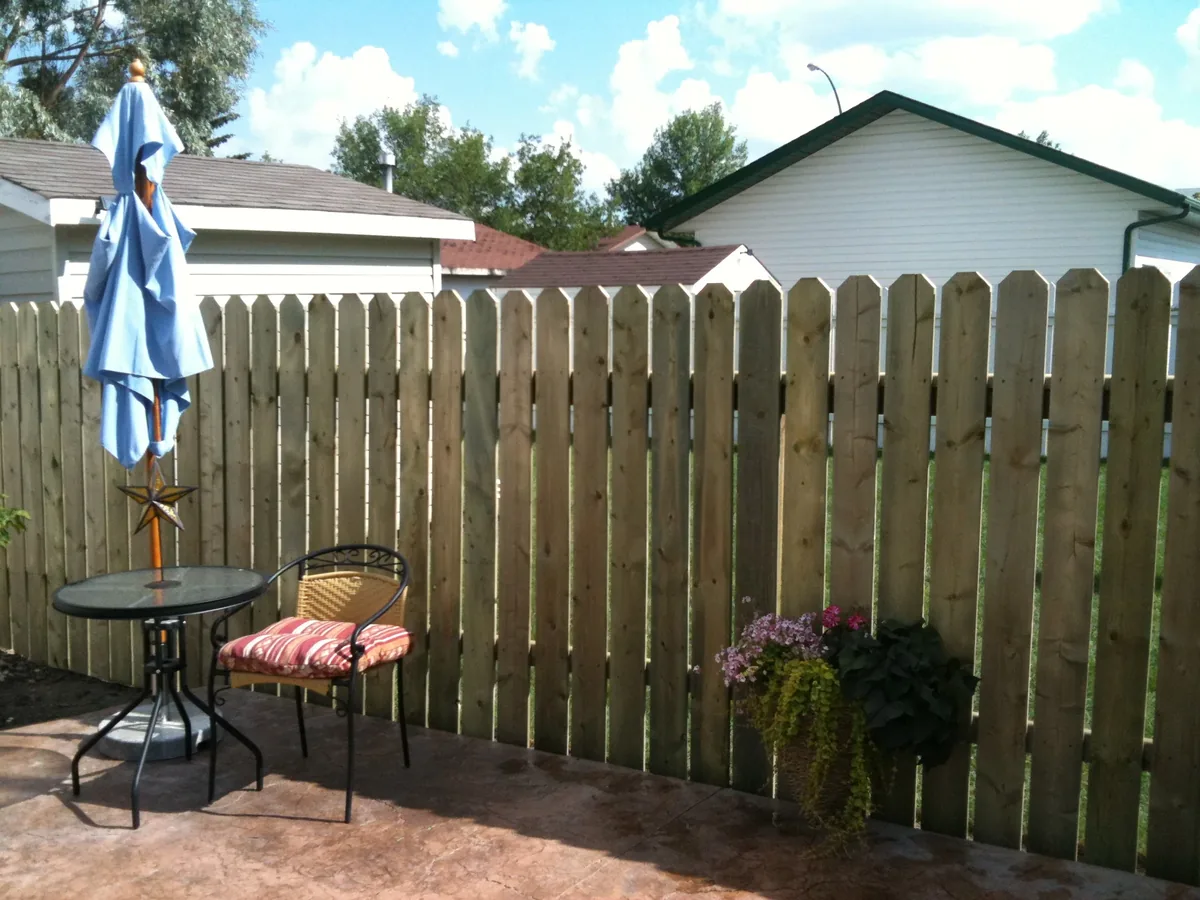 Wood picket fence Saskatoon patio