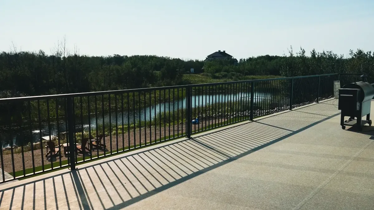 PVC deck with aluminum railing overlooking pond Applewood Estates Saskatoon