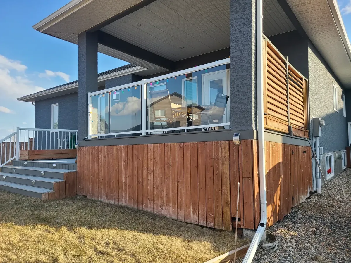Before — deteriorating deck skirting and structure, Warman SK